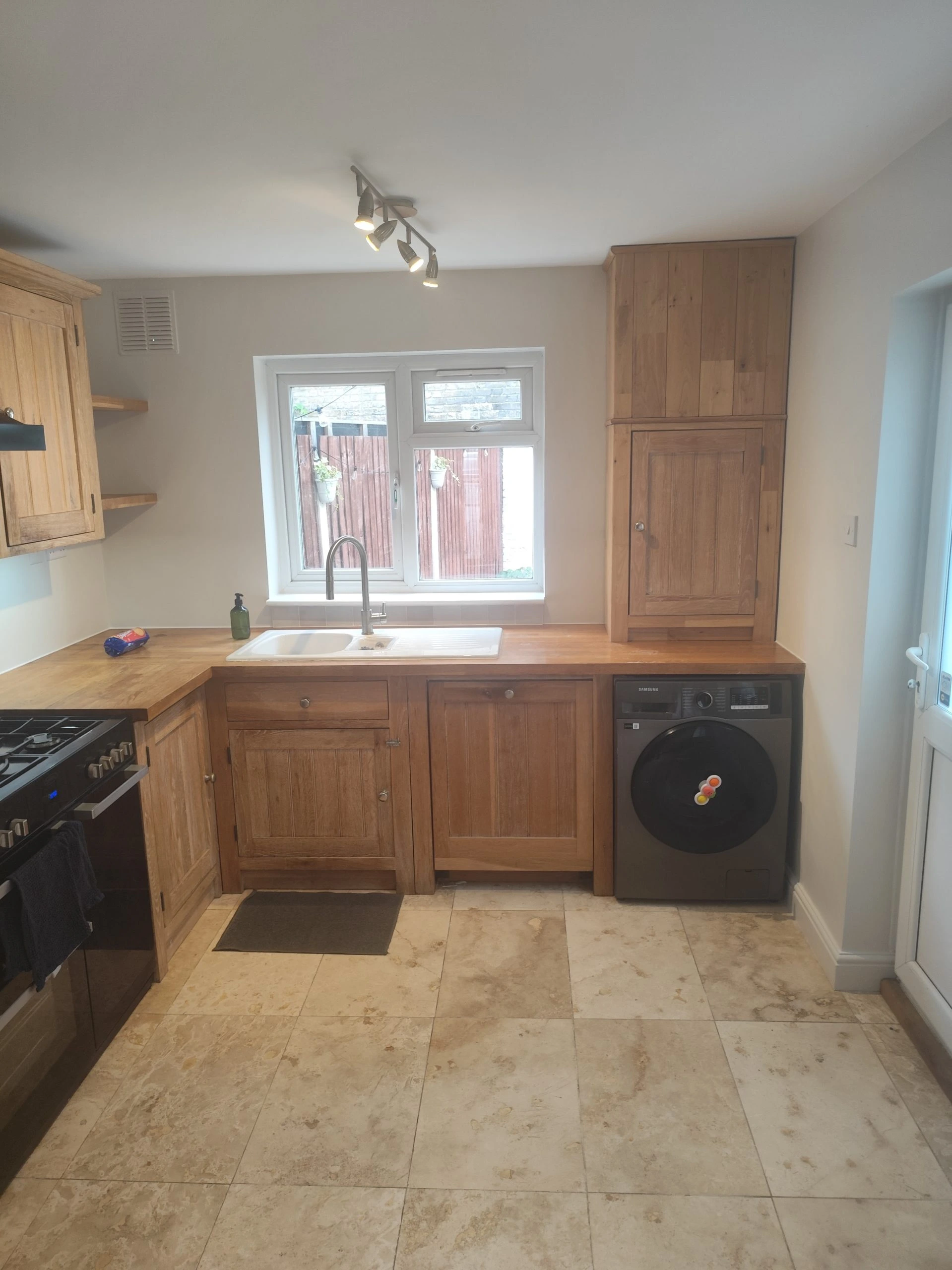 Professional kitchen renovation with painted walls and wooden cabinet detailing