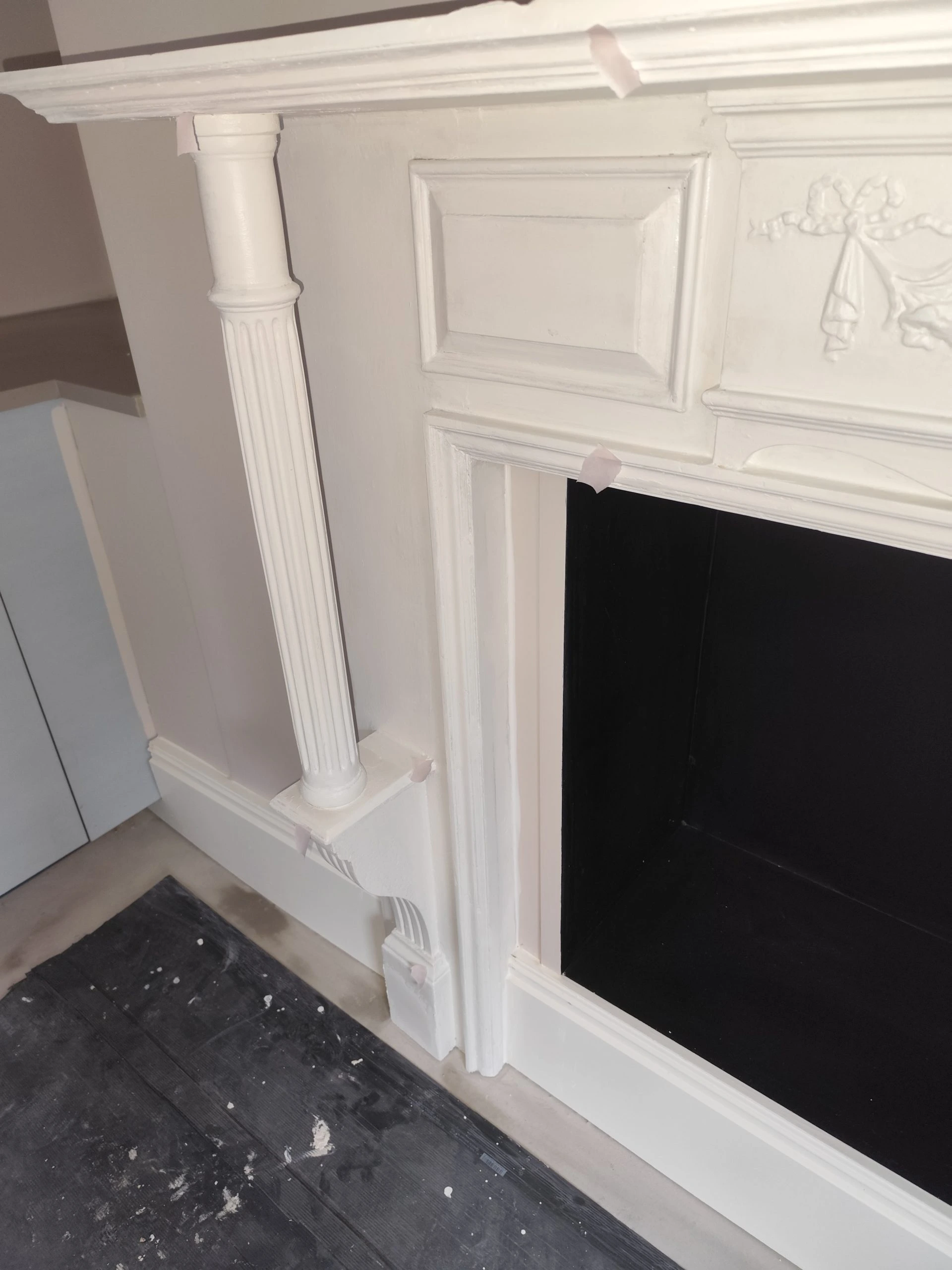 fireplace restoration with fluted column and smooth painted wall finish