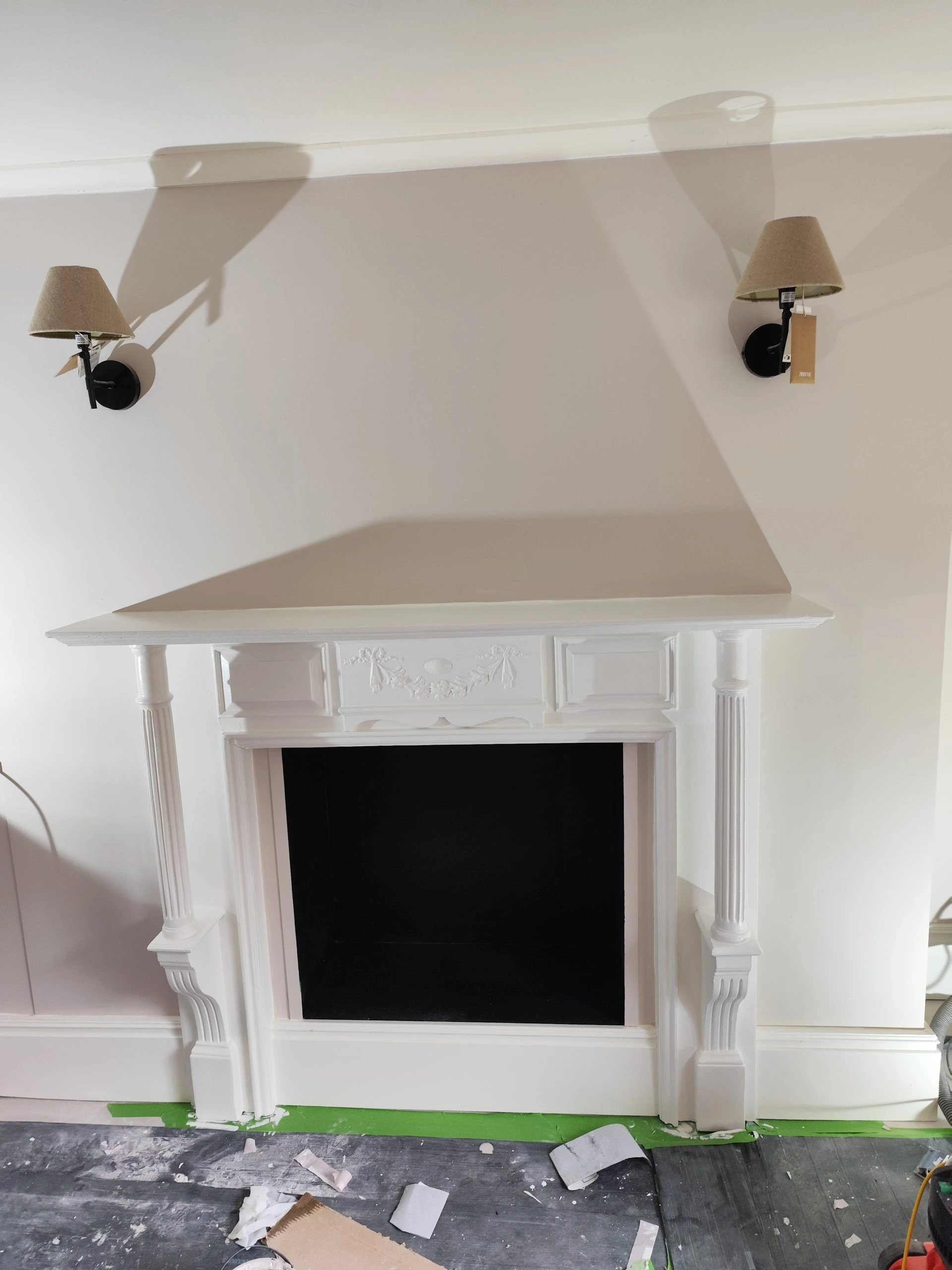 Georgian fireplace restoration detail with fluted column and decorative mouldings in Peckham London